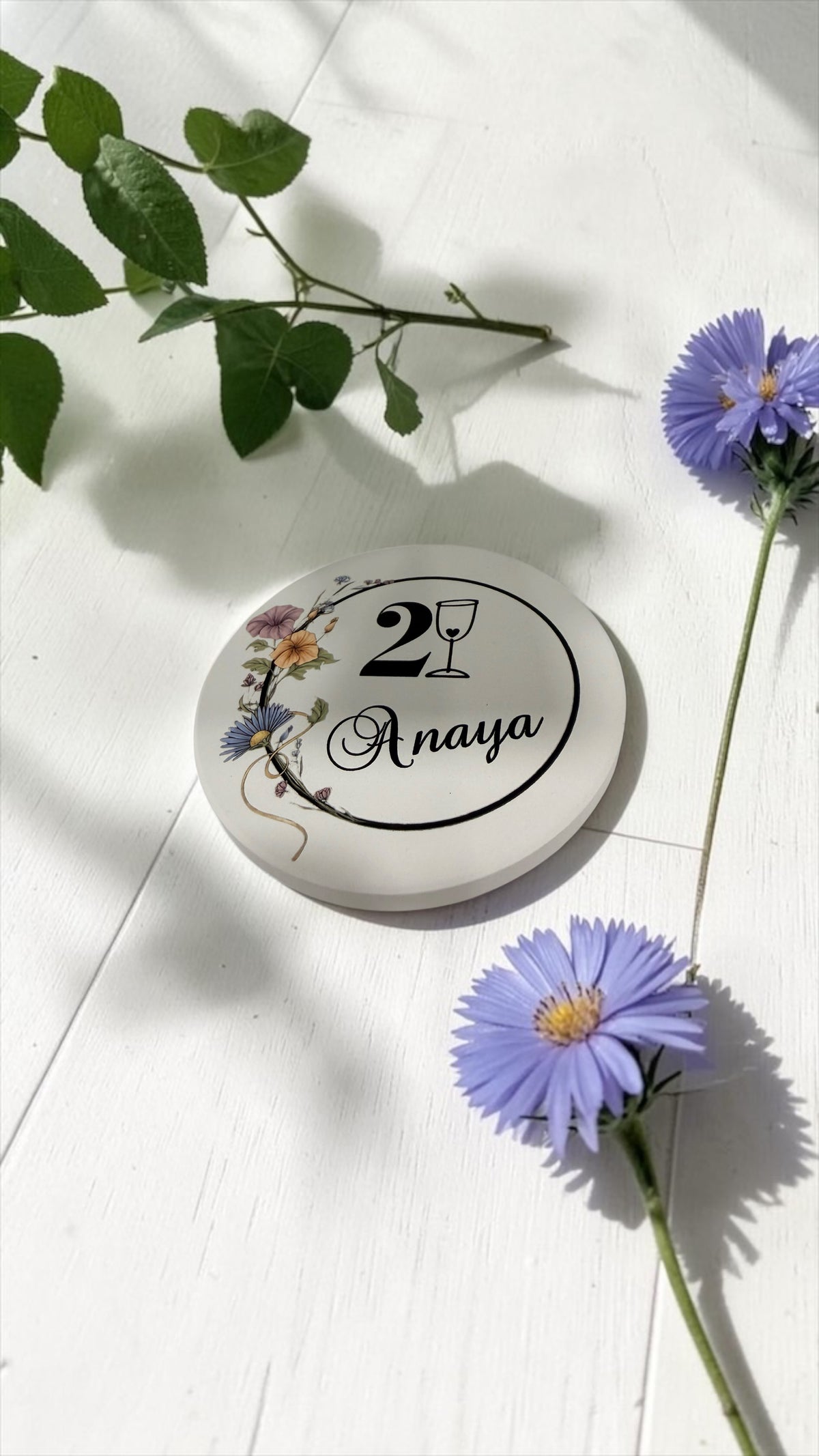 Personalized round ceramic coaster with 21st birthday name design