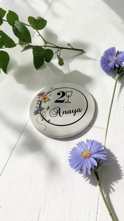 Personalized round ceramic coaster with 21st birthday name design